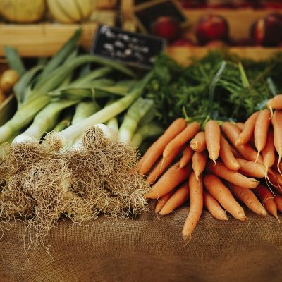 A table full of vegetables including celery and carrots at Marché aux Fleurs. Original public domain image from Wikimedia Commons