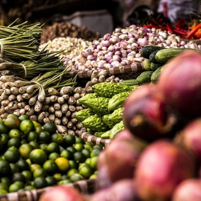 Limes, onions, and lemongrass at a fruit and vegetable stand. Original public domain image from Wikimedia Commons